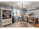 Bright dining area with a table, chairs, and a built-in storage cabinet at 5496 S 237Th Ln, Buckeye, AZ 85326