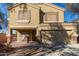 Two-story house with a tan exterior, attached garage, and landscaping at 5496 S 237Th Ln, Buckeye, AZ 85326