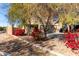 Two-story home with red flowering bushes and a two-car garage at 5496 S 237Th Ln, Buckeye, AZ 85326