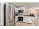 Bright kitchen featuring stainless steel appliances and wood accents at 5496 S 237Th Ln, Buckeye, AZ 85326