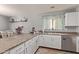 Eat-in kitchen with granite countertops and white cabinets at 5496 S 237Th Ln, Buckeye, AZ 85326