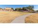 Community park with a walking path and grassy areas at 5496 S 237Th Ln, Buckeye, AZ 85326