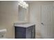 Bathroom features a vanity with granite countertop and a large mirror at 5538 N 63Rd Ave, Glendale, AZ 85301