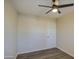 Simple bedroom with ceiling fan and wood-look floors at 5538 N 63Rd Ave, Glendale, AZ 85301