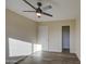 Spacious bedroom with ceiling fan and ample closet space at 5538 N 63Rd Ave, Glendale, AZ 85301