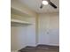 Bedroom with ceiling fan and built-in shelving at 5538 N 63Rd Ave, Glendale, AZ 85301