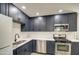 Newly remodeled kitchen with stainless steel appliances and white quartz countertops at 5538 N 63Rd Ave, Glendale, AZ 85301