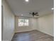 Spacious living room featuring hardwood floors and a ceiling fan at 5538 N 63Rd Ave, Glendale, AZ 85301