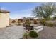 Stone patio, fire pit and desert landscaping at 5715 S Winchester --, Mesa, AZ 85212