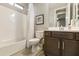 Clean bathroom with a tub, toilet and vanity at 5715 S Winchester --, Mesa, AZ 85212