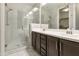 Bathroom features double vanity, large mirror, and glass shower at 5715 S Winchester --, Mesa, AZ 85212