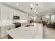 Modern kitchen with white cabinets, marble countertops and island at 5715 S Winchester --, Mesa, AZ 85212