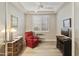 Home office with red recliner, built-ins and window at 5715 S Winchester --, Mesa, AZ 85212