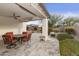 Covered patio with table, chairs and ceiling fan at 5715 S Winchester --, Mesa, AZ 85212