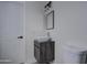 Clean and updated half bathroom with a modern sink and toilet at 6145 W Pierce St, Phoenix, AZ 85043