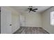 Light and airy bedroom with ceiling fan and wood-look flooring at 6145 W Pierce St, Phoenix, AZ 85043