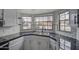 Modern kitchen with white cabinets and black countertops at 6145 W Pierce St, Phoenix, AZ 85043