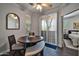 Bright dining area with access to the outdoors and a view into the main bedroom at 7009 E Acoma Dr # 1004, Scottsdale, AZ 85254