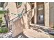 Exterior view of residential building stairs in a neutral stucco color with greenery nearby at 7009 E Acoma Dr # 1004, Scottsdale, AZ 85254