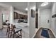 Well-lit kitchen with a breakfast bar, stainless steel appliances, and hardwood flooring at 7009 E Acoma Dr # 1004, Scottsdale, AZ 85254