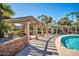 Beautiful community pool area featuring shaded lounge seating and a well-maintained landscape at 7009 E Acoma Dr # 1004, Scottsdale, AZ 85254