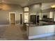 Open kitchen with large island and granite countertops, stainless steel appliances at 7146 W Emile Zola Ave, Peoria, AZ 85381