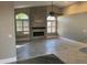 Bright living room features a fireplace and tile flooring at 7146 W Emile Zola Ave, Peoria, AZ 85381