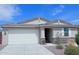 One-story house with white garage door and stone accents at 7284 E Gamebird Way, San Tan Valley, AZ 85143