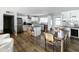 Open concept dining area with a large wooden table and modern chairs at 7301 E Almeria Rd, Scottsdale, AZ 85257