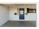 Inviting front door entrance with blue door and a covered porch at 7301 E Almeria Rd, Scottsdale, AZ 85257