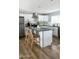 Modern kitchen island with seating and dark countertops at 7301 E Almeria Rd, Scottsdale, AZ 85257