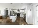 Modern kitchen with white cabinets, stainless steel appliances, and an island at 7301 E Almeria Rd, Scottsdale, AZ 85257