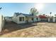 Backyard view of house with covered patio at 7602 W Minnezona Ave, Phoenix, AZ 85033