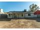 House backyard view with covered patio at 7602 W Minnezona Ave, Phoenix, AZ 85033