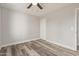 Bright bedroom with wood-look flooring and double door closet at 7602 W Minnezona Ave, Phoenix, AZ 85033