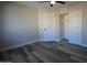 Bright bedroom with vinyl plank flooring and double door closet at 7602 W Minnezona Ave, Phoenix, AZ 85033