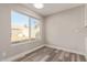 Bright dining area with large window and vinyl wood flooring at 7602 W Minnezona Ave, Phoenix, AZ 85033