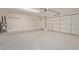 Attached garage with ample space and storage shelving at 7602 W Minnezona Ave, Phoenix, AZ 85033