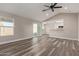 Open concept living room and kitchen with vinyl flooring at 7602 W Minnezona Ave, Phoenix, AZ 85033