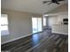 Spacious living room with vinyl plank flooring and access to the backyard at 7602 W Minnezona Ave, Phoenix, AZ 85033