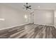 Spacious living room with vinyl wood flooring and a ceiling fan at 7602 W Minnezona Ave, Phoenix, AZ 85033