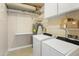 Laundry room with washer, dryer, and shelving at 7729 N Via De Fonda --, Scottsdale, AZ 85258