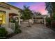 Spacious backyard patio with flagstone, pergola, fountain, and mature trees at 8951 E Wethersfield Rd, Scottsdale, AZ 85260