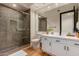 Modern bathroom with a large shower and white vanity at 8951 E Wethersfield Rd, Scottsdale, AZ 85260