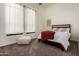 Cozy bedroom with plush carpet and large windows at 8951 E Wethersfield Rd, Scottsdale, AZ 85260