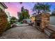 Outdoor oasis with firepit, waterfall, and inviting pool at 8951 E Wethersfield Rd, Scottsdale, AZ 85260