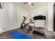 Home gym with treadmill, elliptical, and weights at 8951 E Wethersfield Rd, Scottsdale, AZ 85260