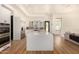 Bright kitchen featuring white cabinetry and a center island at 8951 E Wethersfield Rd, Scottsdale, AZ 85260