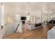 Open living area with kitchen island and staircase at 8951 E Wethersfield Rd, Scottsdale, AZ 85260