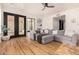 Relaxing living room with a sectional sofa and hardwood floors at 8951 E Wethersfield Rd, Scottsdale, AZ 85260